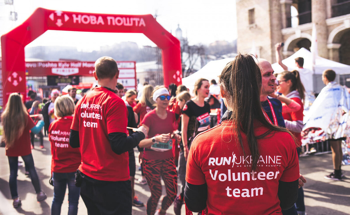 Group of volunteers coordinating a running race