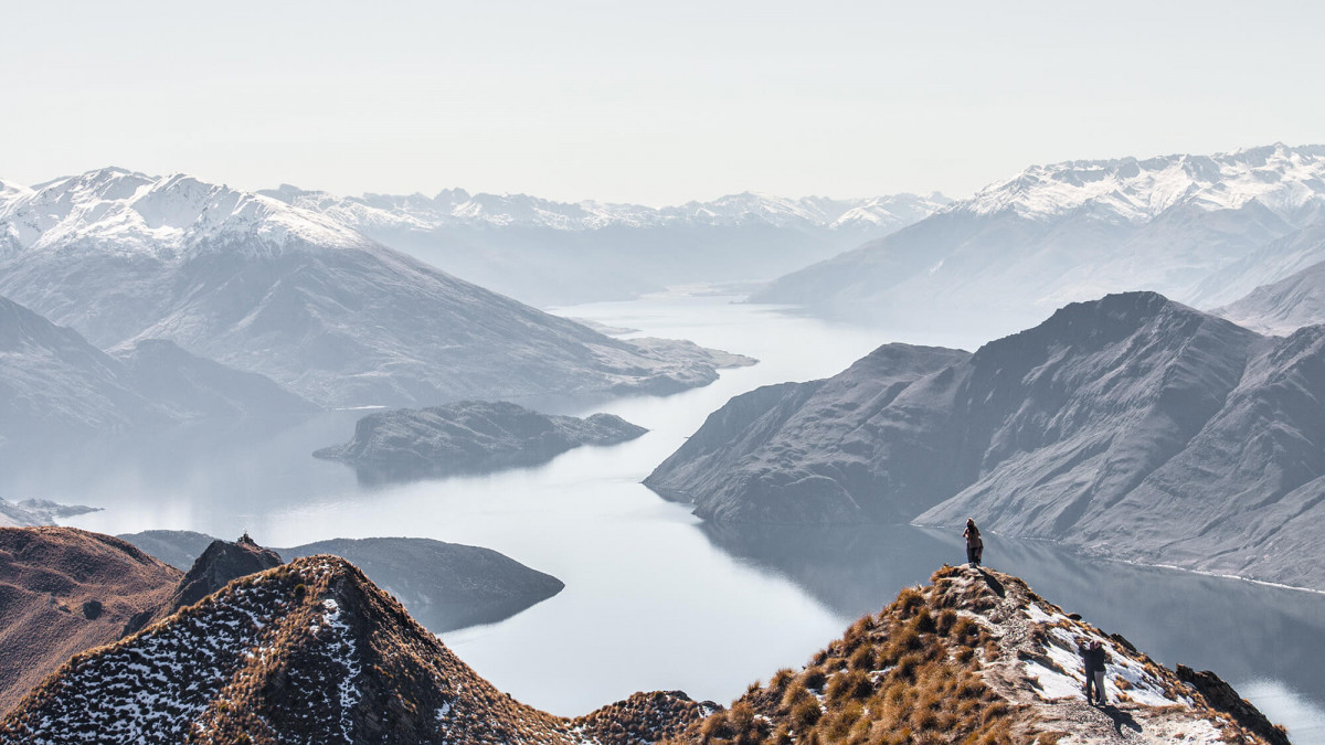 photo of mountain range with river through middle